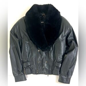 Elegant Black Leather Jacket with Plush Fur Collar
